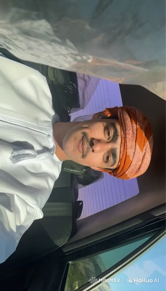 Man in White Garment Observes Mountainous Landscape From Car – AI Generated Video | Hailuo AI
