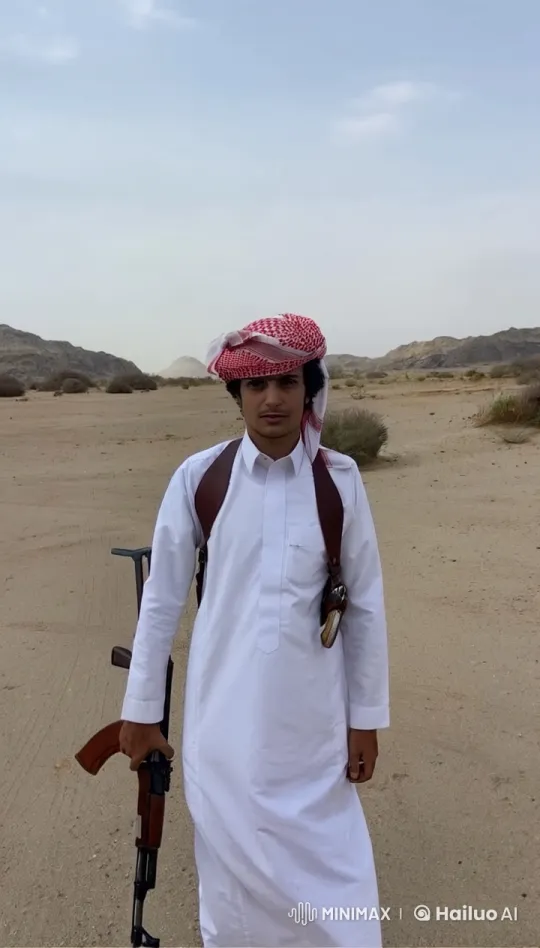 Man in White Thobe Smokes in Desert Landscape – AI Generated Video | Hailuo AI