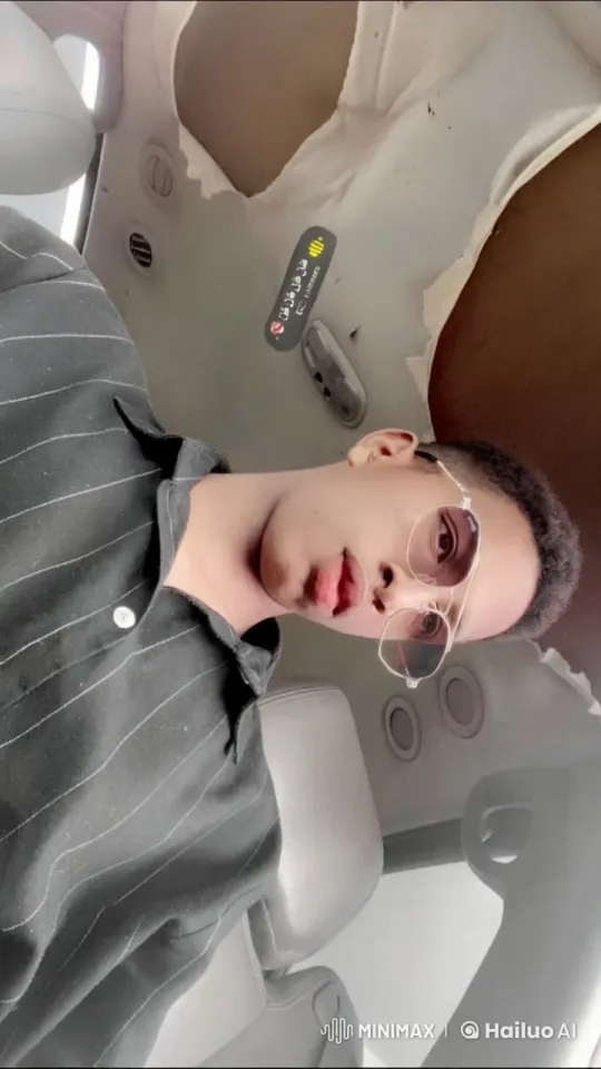 Young Man Relaxing in Car, Smoking – AI Generated Video | Hailuo AI