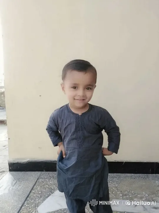 Child Embraces with Sincerity in Traditional Outfit – AI Generated Video | Hailuo AI