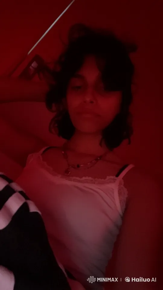 Intimate Red-Hued Bedroom Scene with Smoking Person – AI Generated Video | Hailuo AI