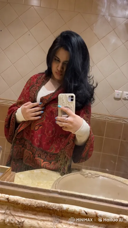 Person Adjusting Shawl, Smoking in Bathroom – AI Generated Video | Hailuo AI