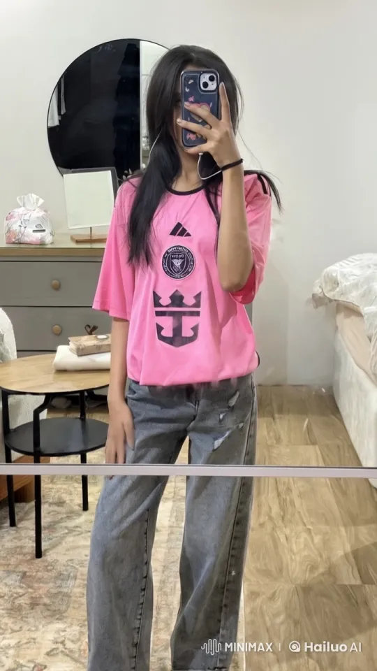 Young Woman in Miami Jersey Takes Mirror Selfie – AI Generated Video | Hailuo AI