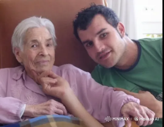 Affectionate Intimacy: Elderly Woman and Younger Man's Tender Moment – AI Generated Video | Hailuo AI