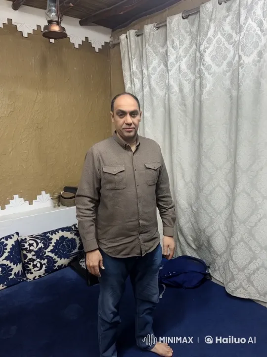 Man Smokes Cigarette in Cozy Blue and White Room – AI Generated Video | Hailuo AI