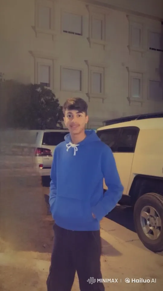 Young Man Smokes Calmly in Nighttime Parking Area – AI Generated Video | Hailuo AI
