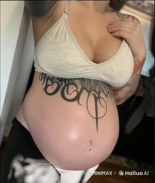 Pregnant Woman With Tattooed Belly Lovingly Touches Her Belly – AI Generated Video | Hailuo AI