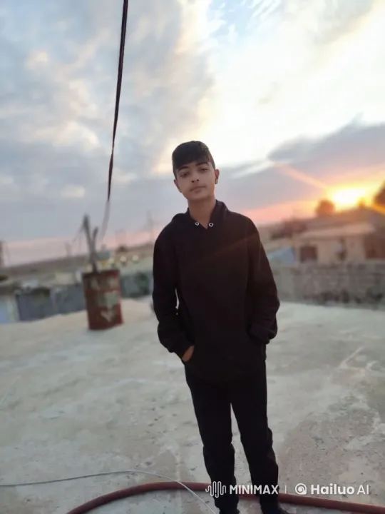 Young Man Smokes on Rooftop at Sunset – AI Generated Video | Hailuo AI