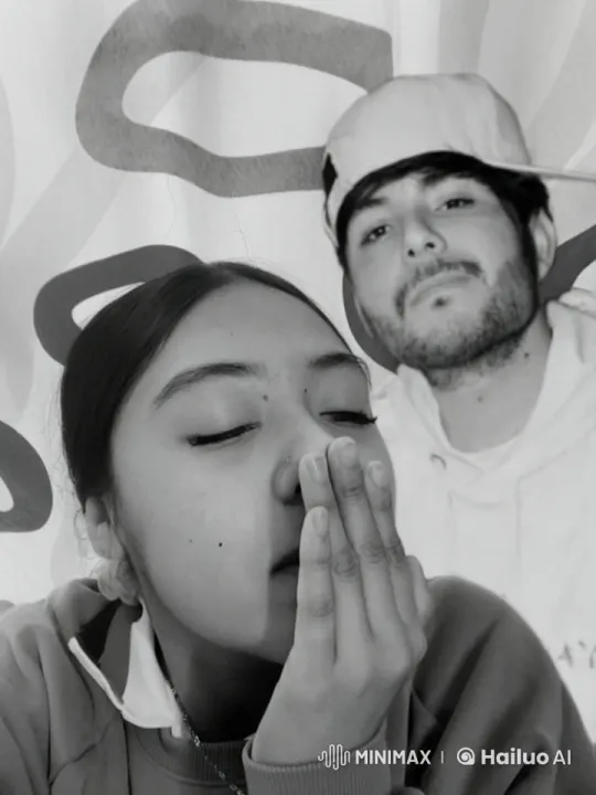 Affectionate Moment: Two Individuals Sharing a Quick Kiss – AI Generated Video | Hailuo AI