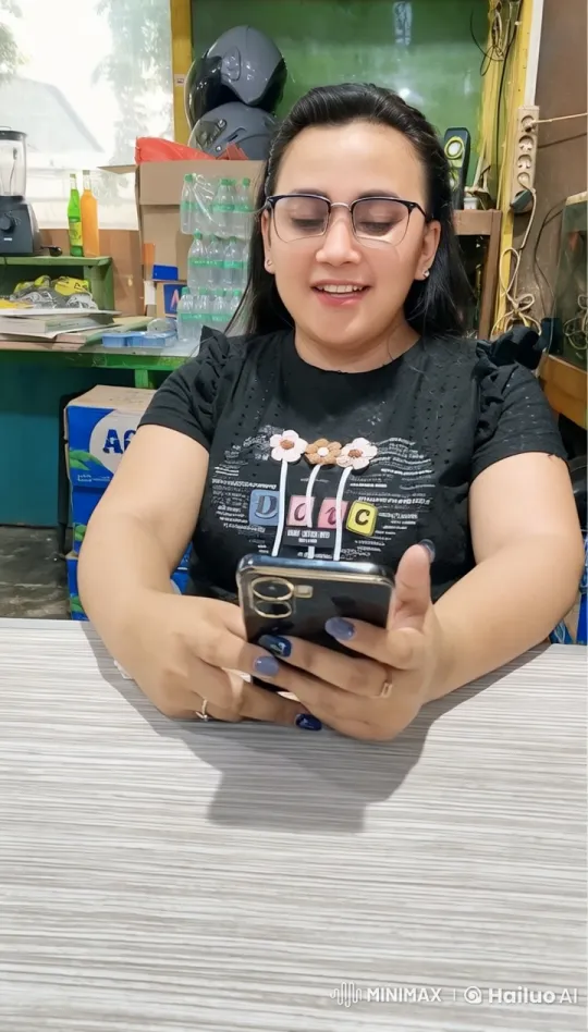 Woman Smiling with Smartphone in Bright Room – AI Generated Video | Hailuo AI