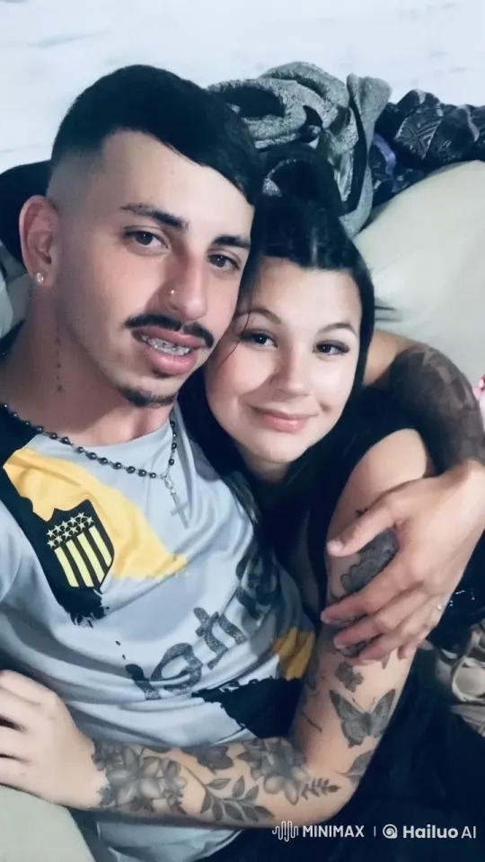Couple with Tattoos Share Intimate Moment on Couch – AI Generated Video | Hailuo AI