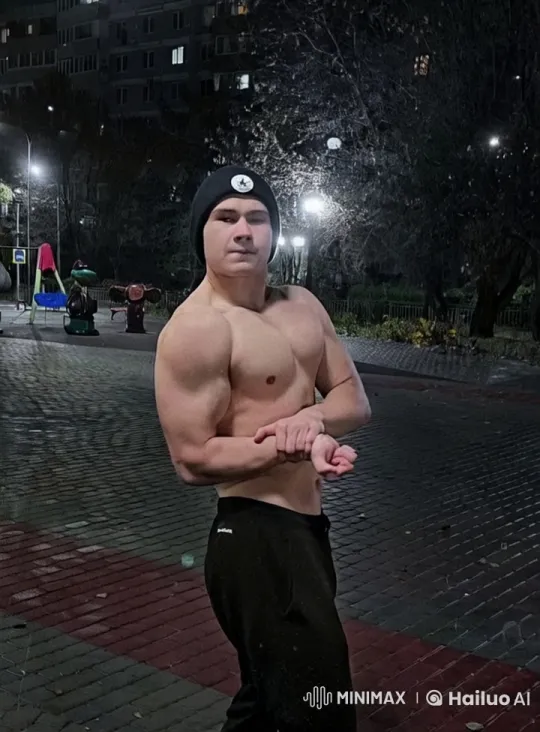 Muscular Individual Showcases Strength in Nighttime Urban Setting – AI Generated Video | Hailuo AI