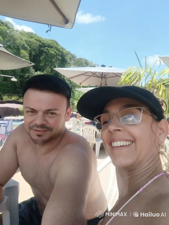 Couple Enjoying Sunny Poolside Relaxation – AI Generated Video | Hailuo AI