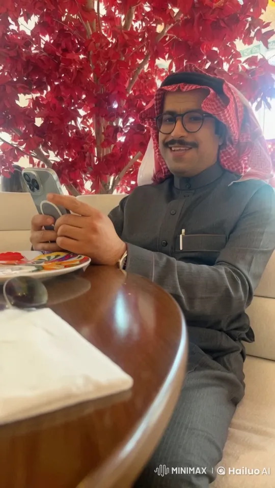 Man Smoking, Engaged with Smartphone in Restaurant – AI Generated Video | Hailuo AI