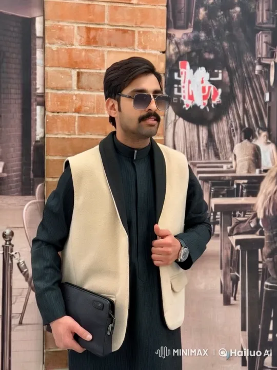 Man in Black Attire Reflects at Café – AI Generated Video | Hailuo AI
