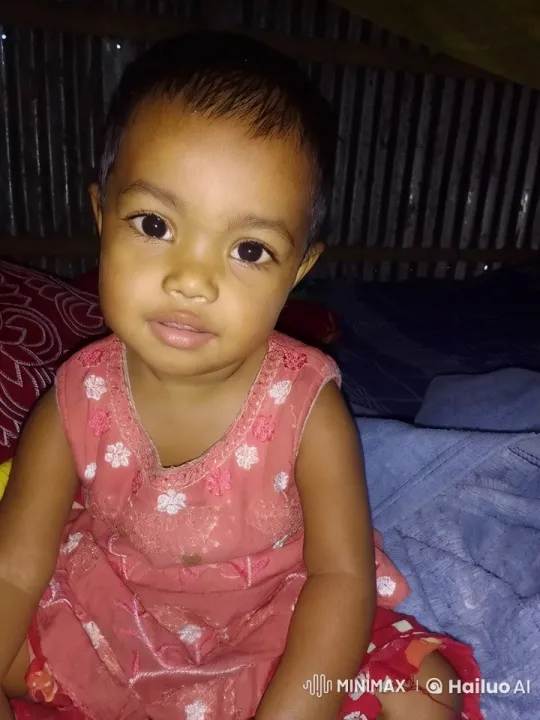 Content Child in Cozy Room with Embroidered Dress – AI Generated Video | Hailuo AI