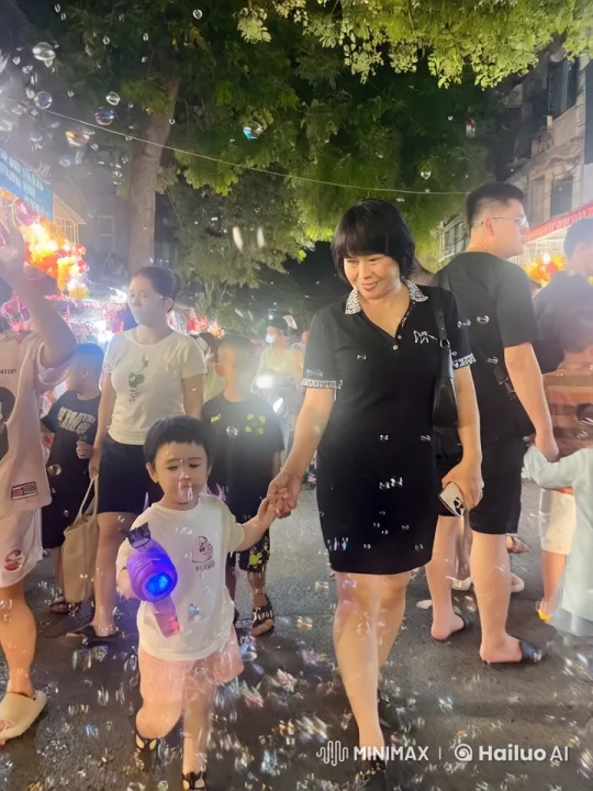 Night Market: Child Practicing Martial Arts Amidst Bubbles – AI Generated Video | Hailuo AI