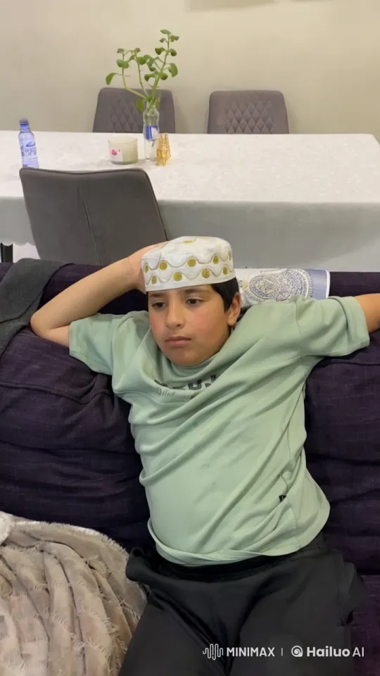 Young Boy Relaxing with Cigarette on Couch – AI Generated Video | Hailuo AI