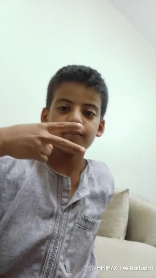 Young Person Simulating Smoking on Sofa – AI Generated Video | Hailuo AI