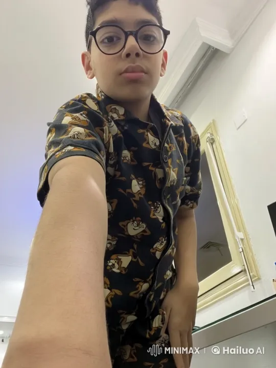 Person Smokes Casually in Well-Lit Indoor Room – AI Generated Video | Hailuo AI