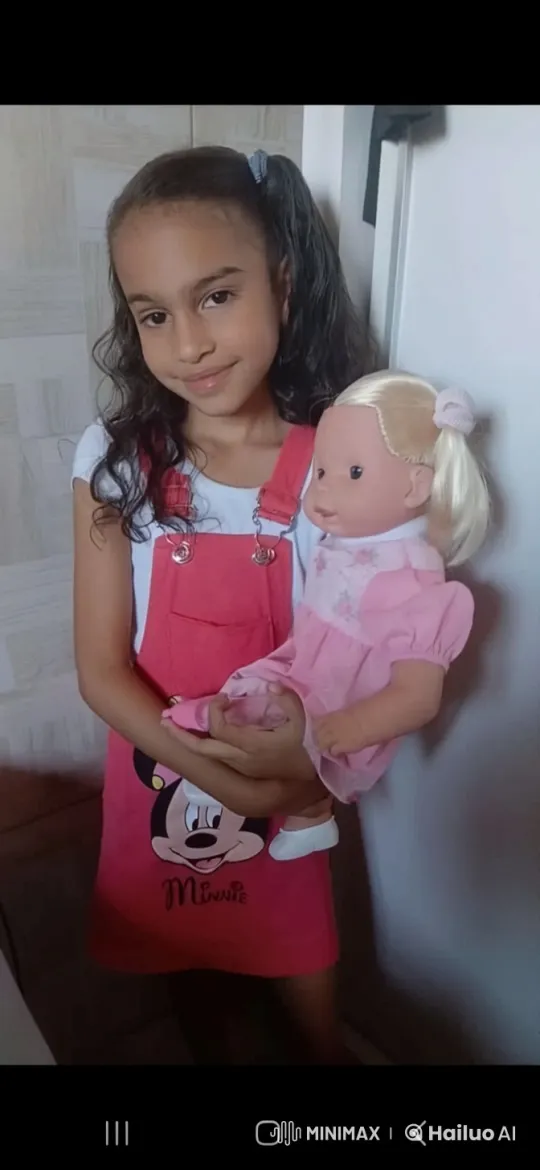 Young Girl Nurtures Doll in Tender Moment – AI Generated Video | Hailuo AI