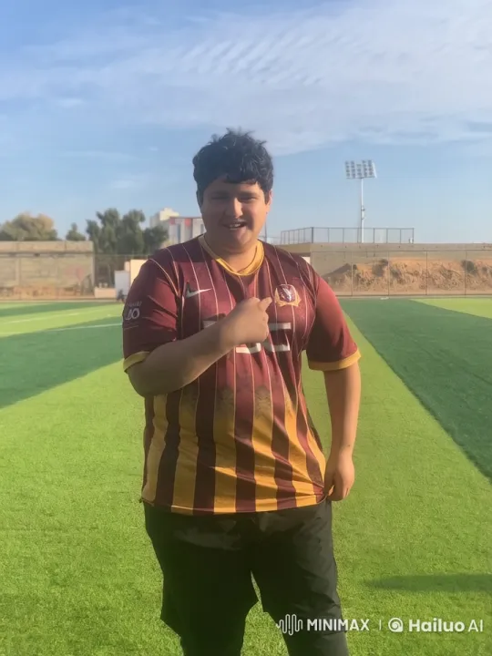 Man Smoking on Soccer Field with Distant Floodlight – AI Generated Video | Hailuo AI