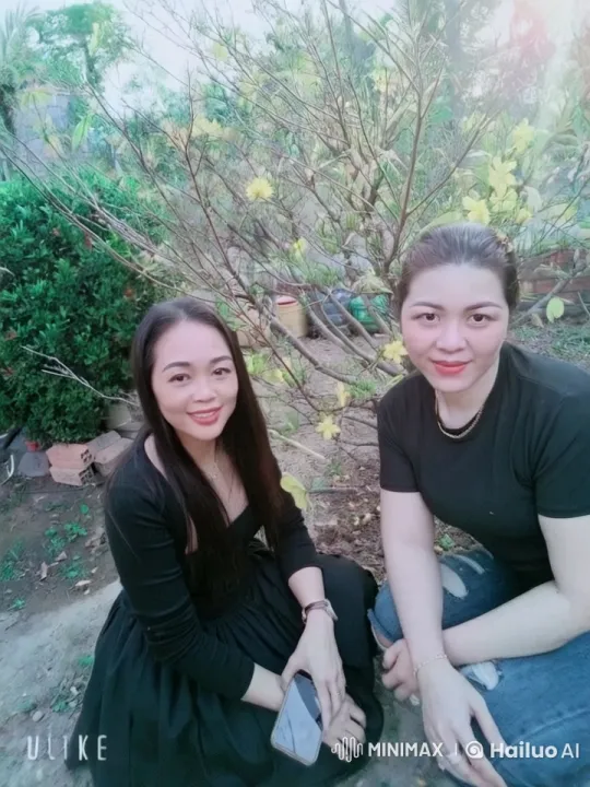 Two Women Chat in a Peaceful Garden Setting – AI Generated Video | Hailuo AI