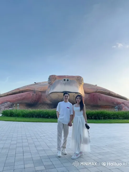 Couple Practicing Martial Arts in Front of Turtle Sculpture – AI Generated Video | Hailuo AI
