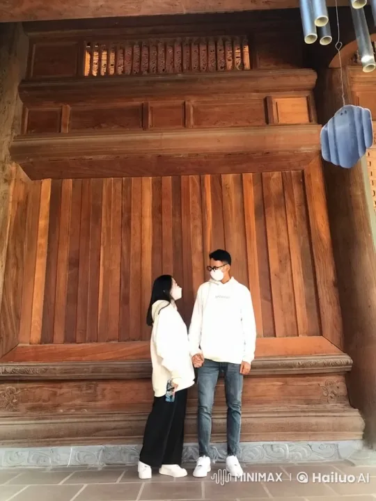 Couple's Graceful Kung-Fu Fight in Front of Wooden Structure – AI Generated Video | Hailuo AI