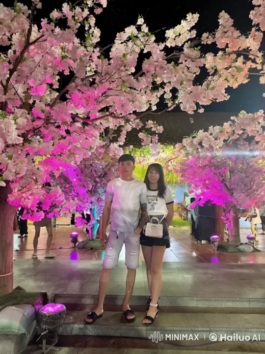 Martial Artists' Graceful Kungfu Combat in Cherry Blossom Setting – AI Generated Video | Hailuo AI
