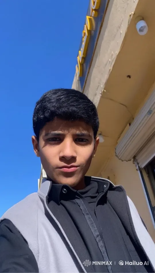 Person Smoking Outside Building on Sunny Day – AI Generated Video | Hailuo AI