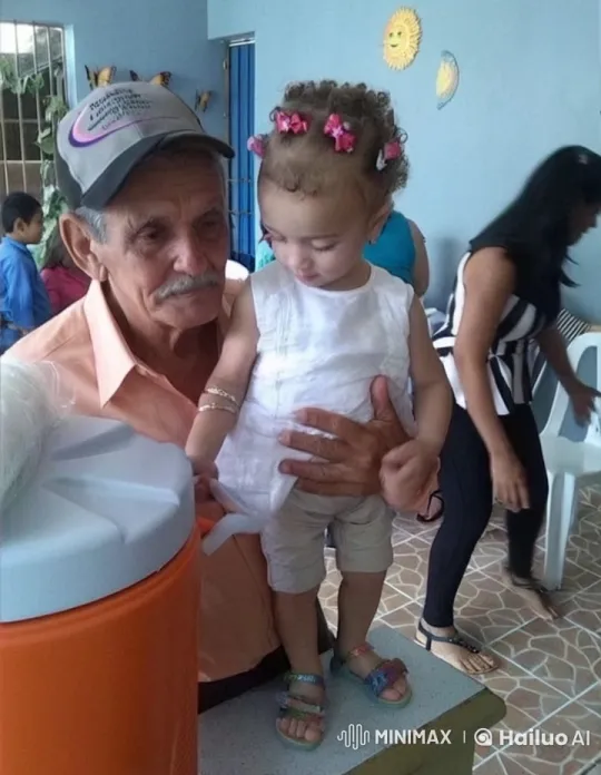 Elderly Man Comforts Curly-haired Child Indoors – AI Generated Video | Hailuo AI
