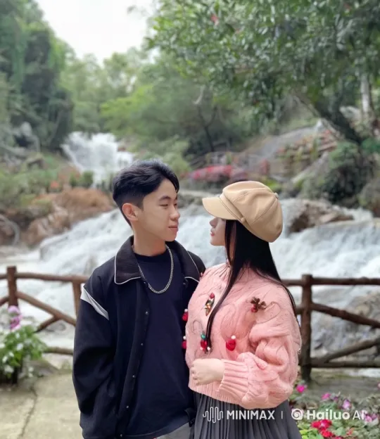 Playful Couple at Serene Waterfall Landscape – AI Generated Video | Hailuo AI