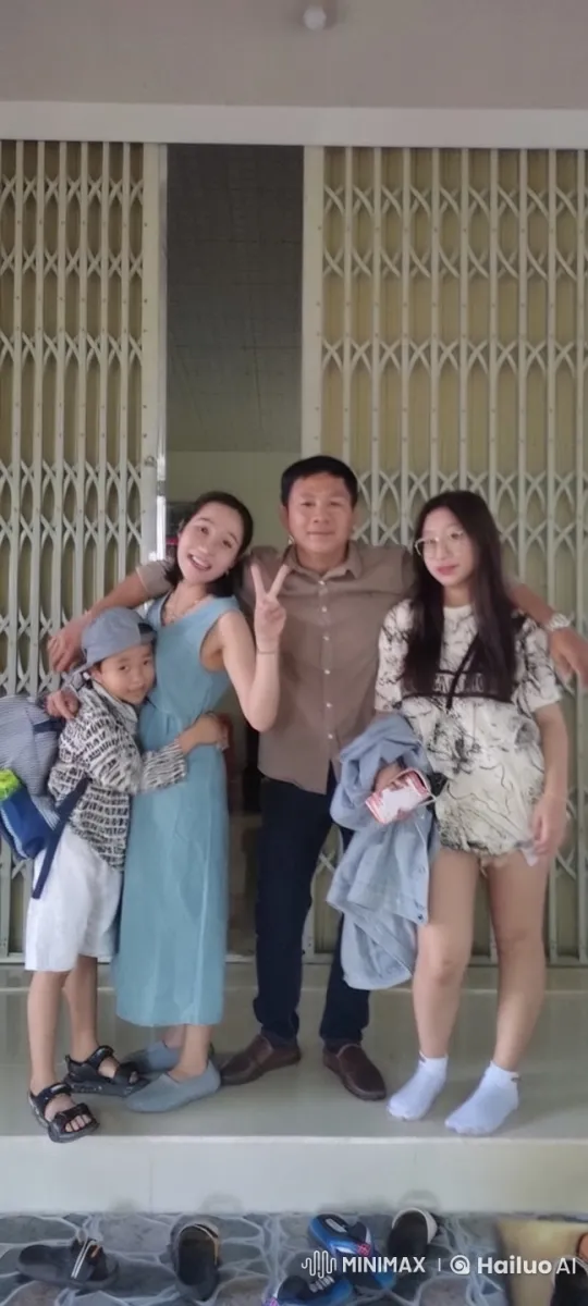 Family Embraces and Playfully Tussles in Front of Gate – AI Generated Video | Hailuo AI
