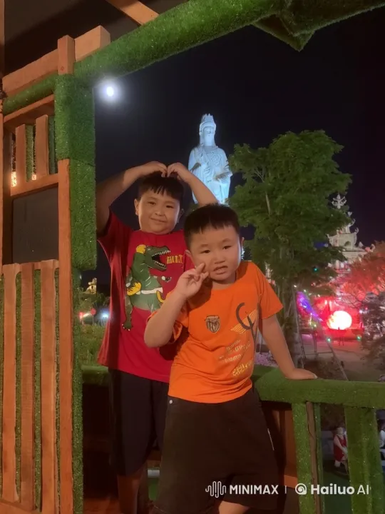 Boys' Playful Silhouettes Against Nighttime Lanterns – AI Generated Video | Hailuo AI