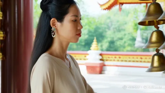 Woman in Temple: Touching Bells, Capturing Serenity – AI Generated Video | Hailuo AI