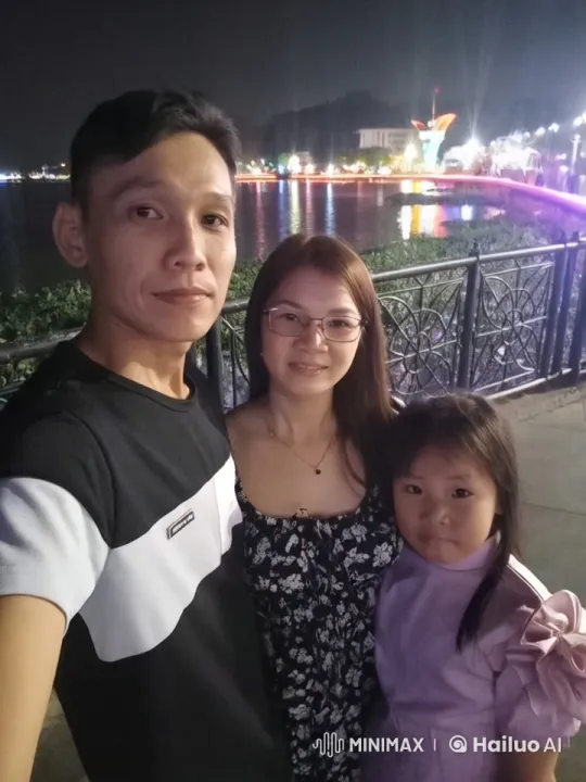 Family Enjoying Peaceful Night by Festive Lake – AI Generated Video | Hailuo AI