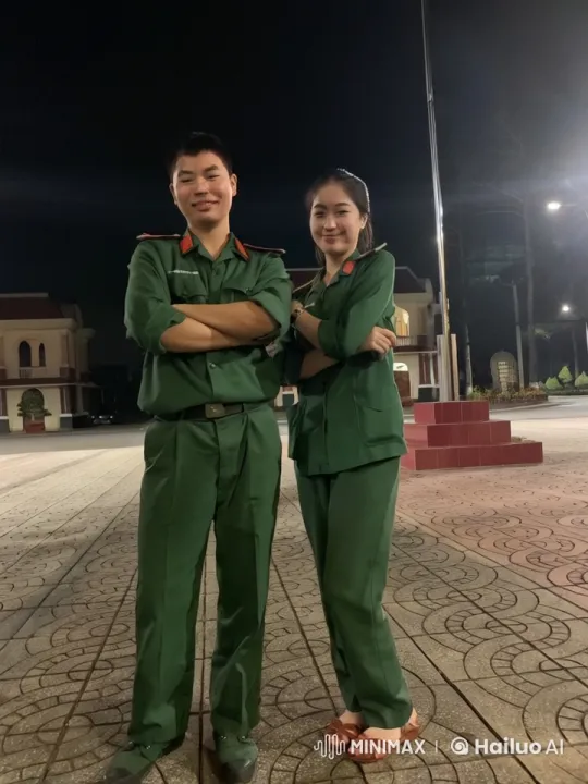 Nighttime Martial Arts Display by Military Uniformed Pair – AI Generated Video | Hailuo AI