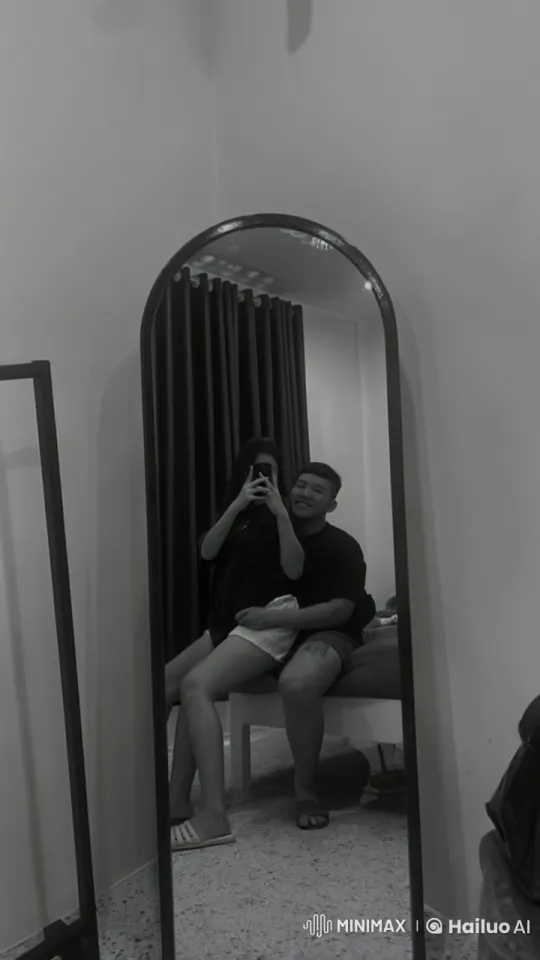 Couple's Playful Intimacy Captured in Mirror Reflection – AI Generated Video | Hailuo AI