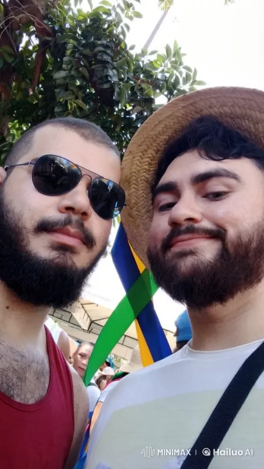 Two Men's Journey from Playful Fight to Romantic Kiss in a Festive Setting – AI Generated Video | Hailuo AI