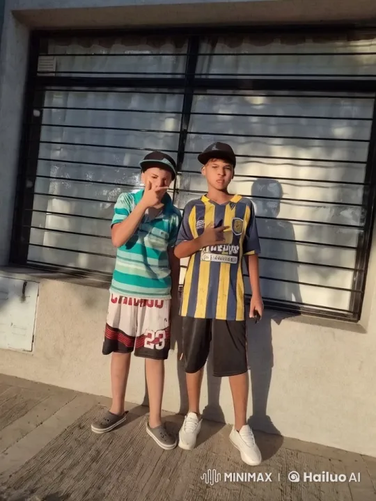 Two Boys in Striped Shirts Pose Playfully – AI Generated Video | Hailuo AI