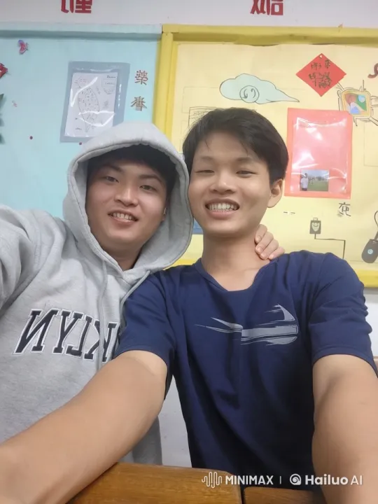 Two Friends Taking a Selfie in a Classroom – AI Generated Video | Hailuo AI