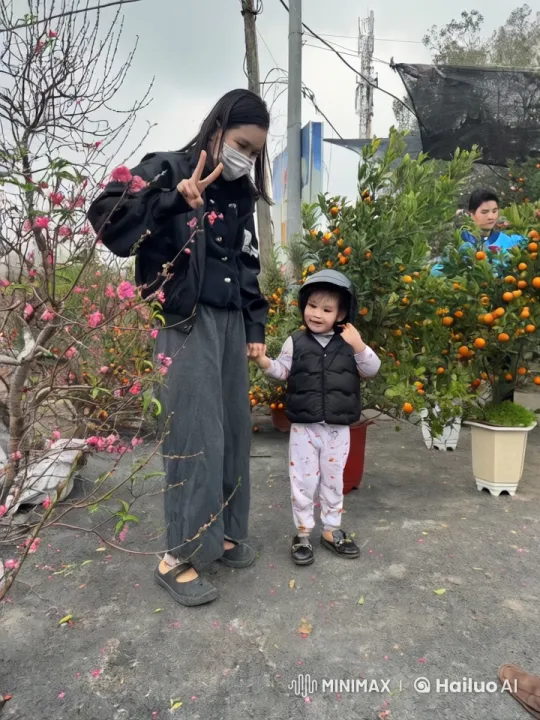 Young Girl and Child Practice Martial Arts in a Blossoming Garden – AI Generated Video | Hailuo AI