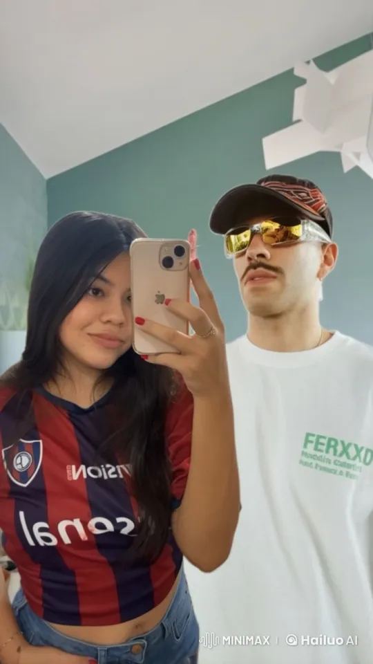 Couple Taking a Selfie in a Cozy Green Room – AI Generated Video | Hailuo AI