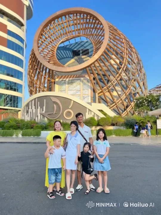 Family Poses with Children Performing Kung Fu in Front of Bamboo Landmark – AI Generated Video | Hailuo AI