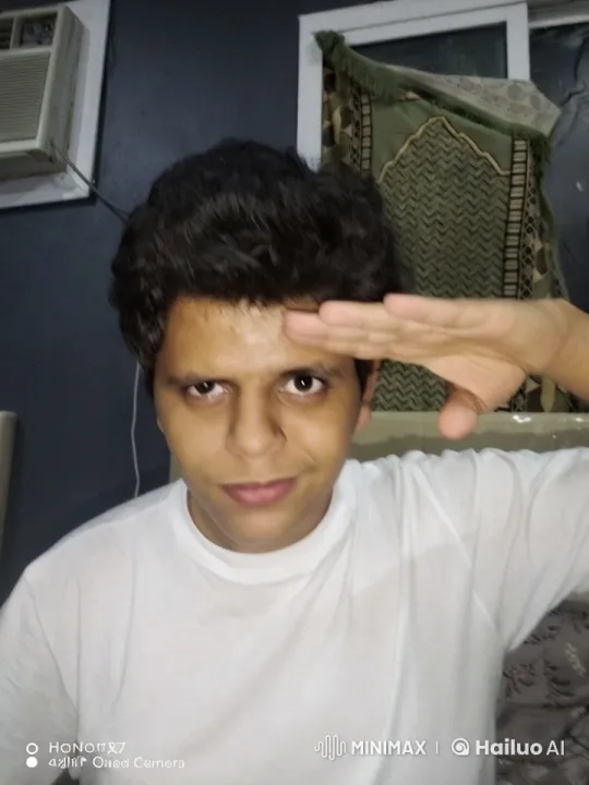 Curly-haired Person Salutes, Smokes in Static Room – AI Generated Video | Hailuo AI