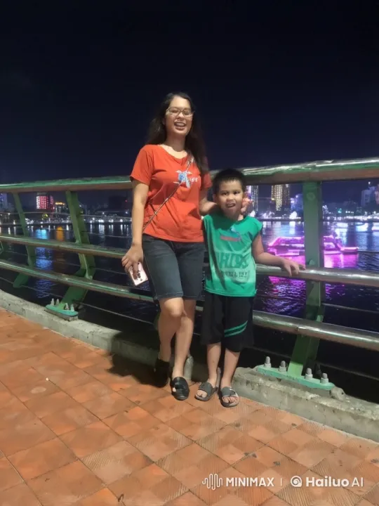 Woman and Boy Practicing Kung Fu by River at Night – AI Generated Video | Hailuo AI