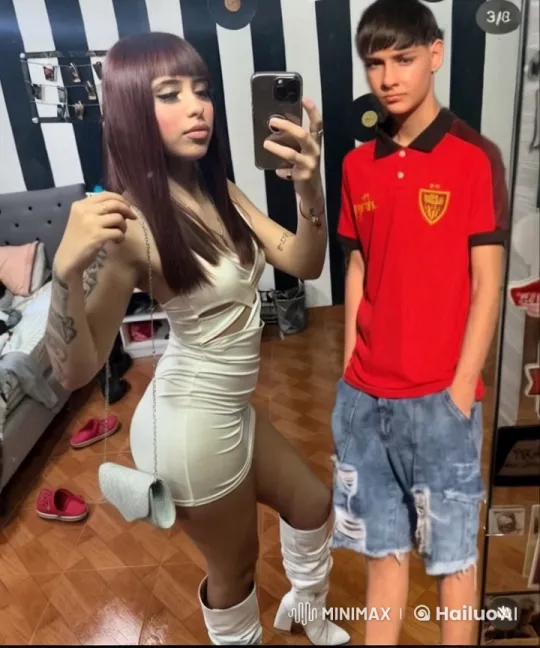 Young Couple Takes Mirror Selfie in Cozy Bedroom – AI Generated Video | Hailuo AI
