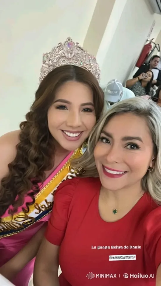 Affectionate Embrace Between Pageant Queen and Woman in Red – AI Generated Video | Hailuo AI
