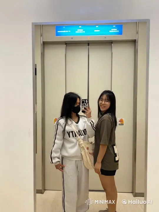 Casual Dressed Duo's Martial Arts Selfie in Front of Elevator – AI Generated Video | Hailuo AI